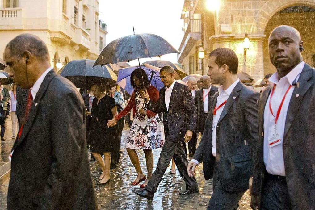 Barack Obama walks with first lady Michelle Obama and her mother Marian Robinson, through Old Havana. Photo: AP
