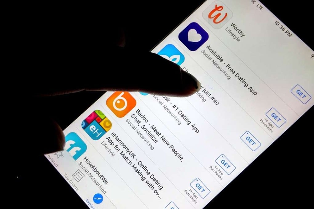 A woman scrolls through the featured dating apps on the iPhone’s app store. Photo: SCMP Pictures