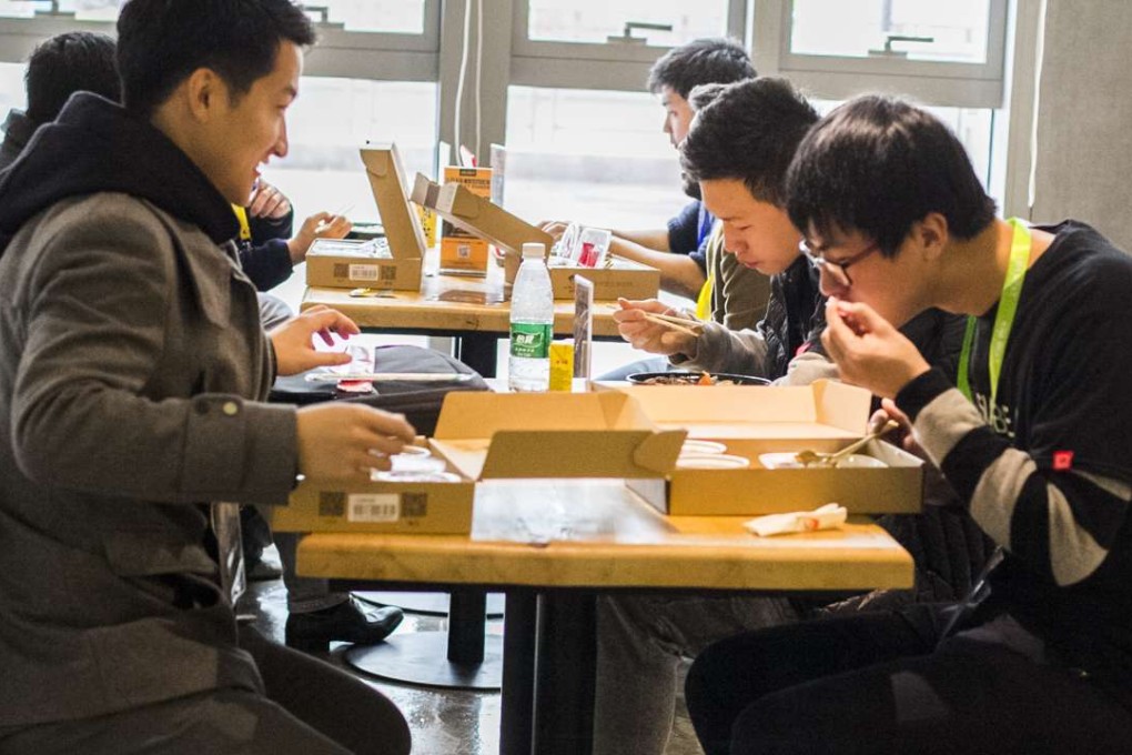 Diners in Xiamen tuck into Diet Internet’s ready to eat meals. Photo: SCMP Handout