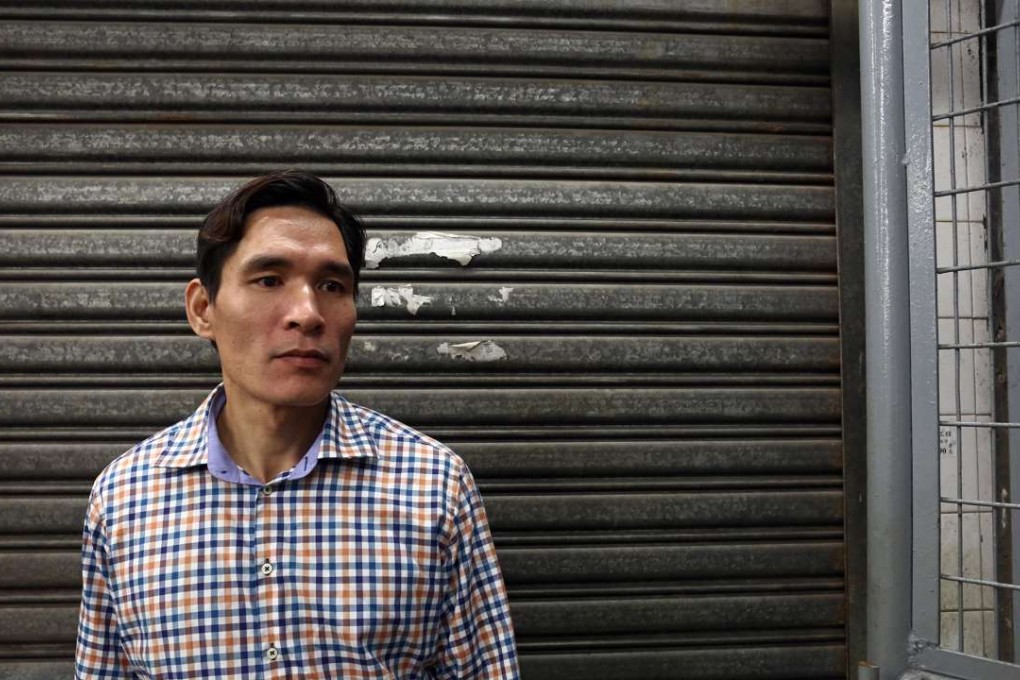 Ngo Van Duong, a Vietnamese illegal immigrant living in Hong Kong for the past two years, near the jade and stone market in Sham Shui Po. Photos: Jonathan Wong
