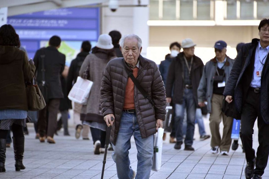 An elderly man walks with a stick in Yokohama, near Tokyo in Japan. Photo: EPA