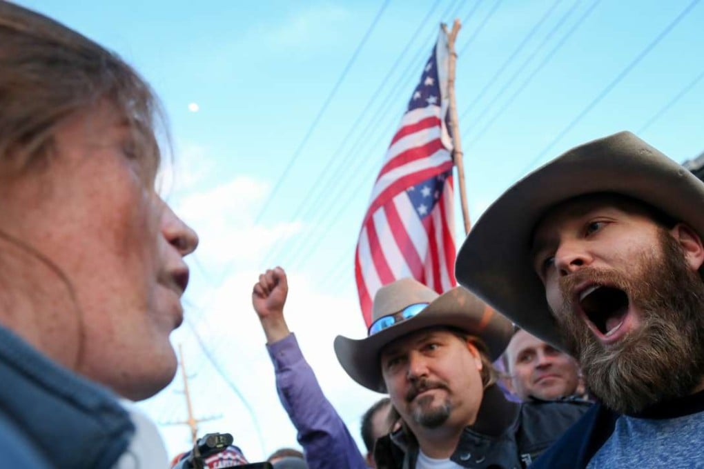 A protester (left) confronts supporters of Republican presidential candidate Donald Trump in downtown Salt Lake City, Utah, last Friday. Photo: AP