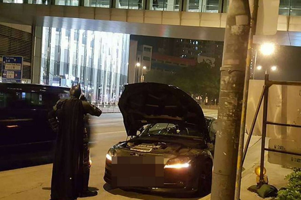 Batman was seen speaking on the phone when his batmobile broke down in Central. Photo: Facebook