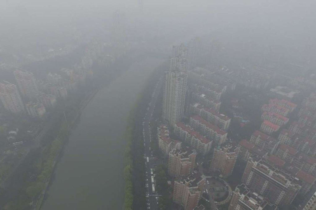 Good for the environment? China’s notorious smog clouds cover residential buildings in Nanjing, Jiangsu province. Photo: Reuters