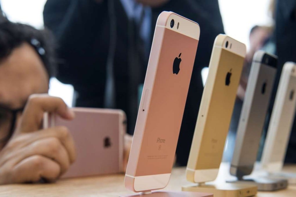 An attendee takes a photograph of the new iPhone SE smartphone at its unveiling in Cupertino, California, on Monday, . Photo: Bloomberg