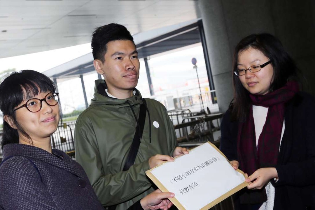 Liz Tam (left) and Hui Yung-chu from a student concern group with a letter for the Education Bureau in Tamar. Photo: Felix Wong