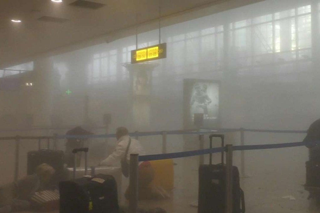 A smoke-filled Brussels Airport after explosions turned morning travellers into victims March 22 Photo: Ralph Usbeck/AP