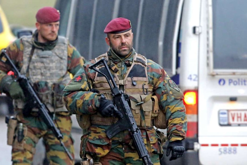 Belgian soldiers check vehicles of airport workers on their arrival at Zaventem airport in Brussels, Belgium. Security services are on high alert following two explosions in the departure hall of Zaventem Airport and later one at Maelbeek Metro station in Brussels yesterday. Photo: EPA