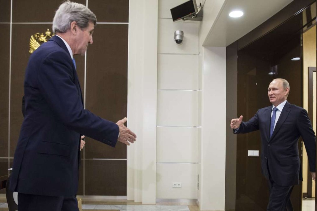 US Secretary of State John Kerry (left) is welcomed by Russian President Vladimir Putin in Sochi, Russia, last May. The pair will meet again in Russia this week. Photo: AP