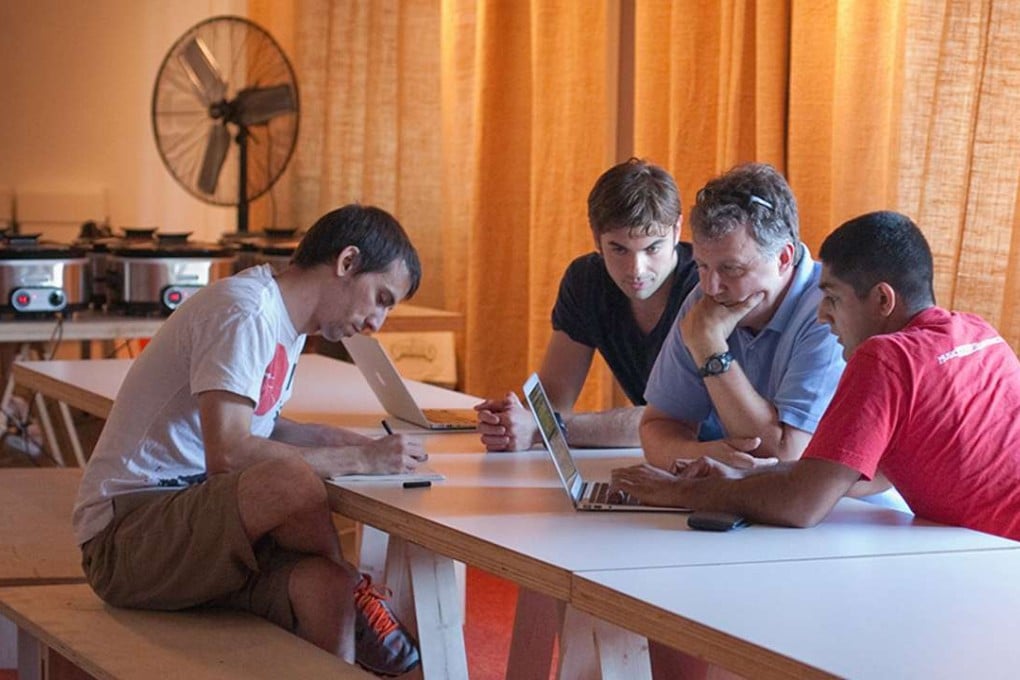 Paul Graham, seen here wearing a black t-shirt, is the founder of Y Combinator. Photo: Handout