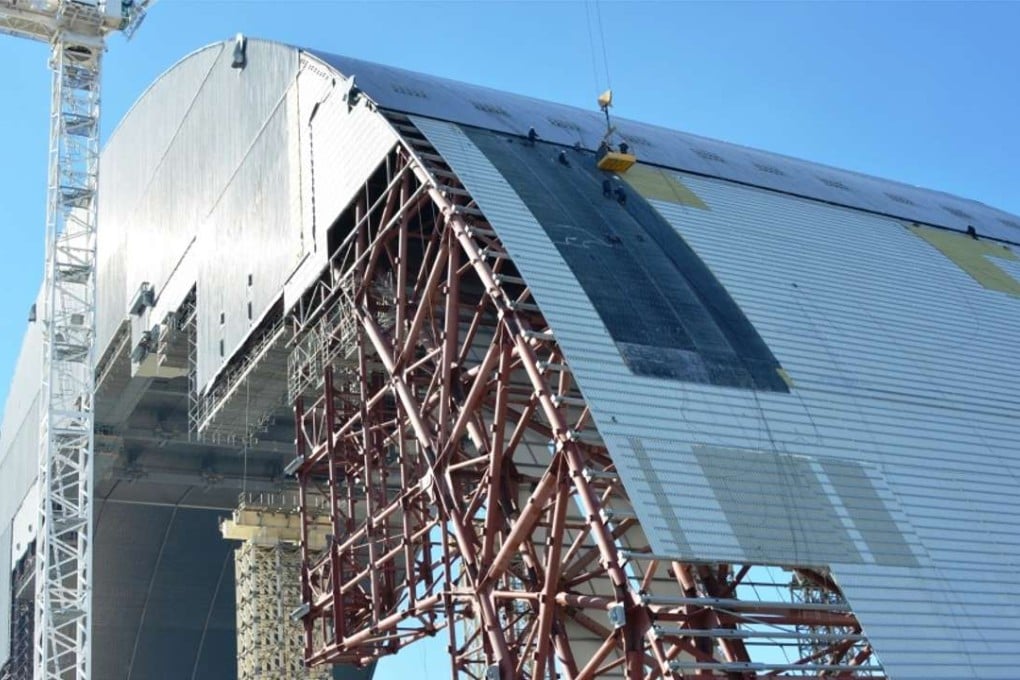The giant “New Safe Confinement” arch. The steel structure, weighing 30,000 tonnes, is designed to enclose the Chernobyle reactor. Photo: Chernobyl Foundation