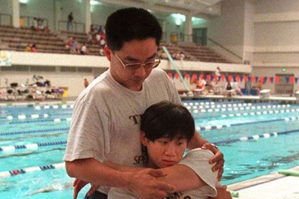 Zhou Ming with Chinese swimmer Le Jingyi at the 1996 Atlanta Olympics. Photo: AFP