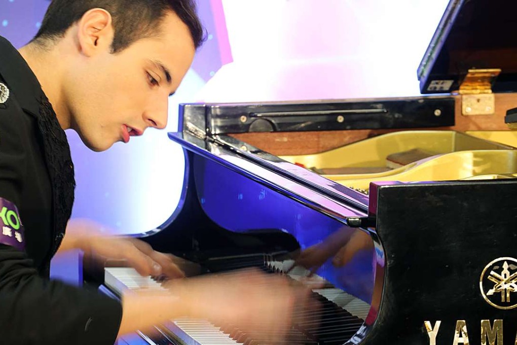 Guinness World Record breaker Peter Bence hit the keys 765 times in one minute. Photo: Felix Wong