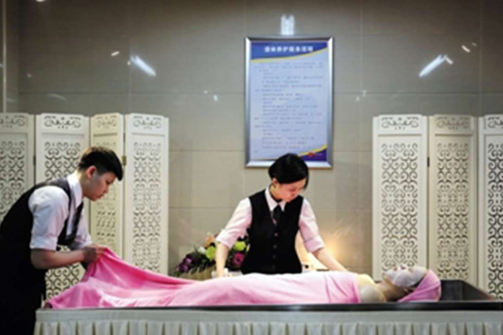 Staff at the home showing how they carry out treatments for clients. Photo: China News Service