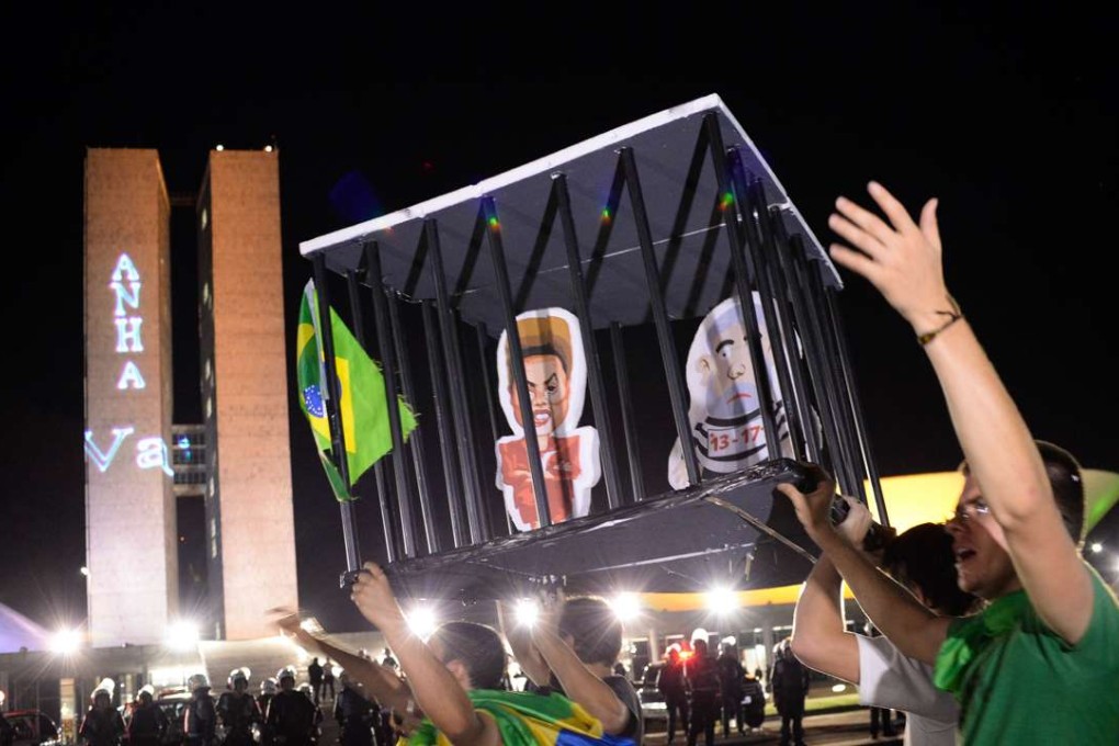 Demonstrators outside the National Congress protest against the administration of President Dilma Rousseff and in support of Judge Sergio Moro, who is spearheading the Operation Car Wash anti-corruption investigation, in Brasilia. Photo: AFP