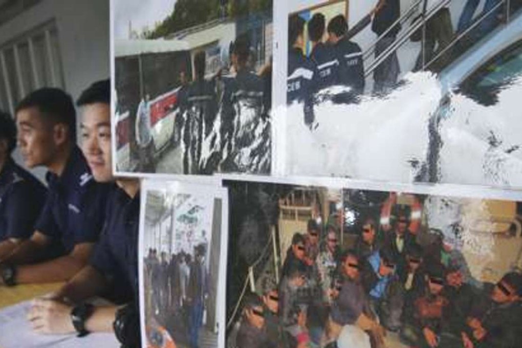 Marine police officials at a press conference describing the arrest of 22 illegal immigrants found off Lantau Island in early March. Photo: Sam Tsang