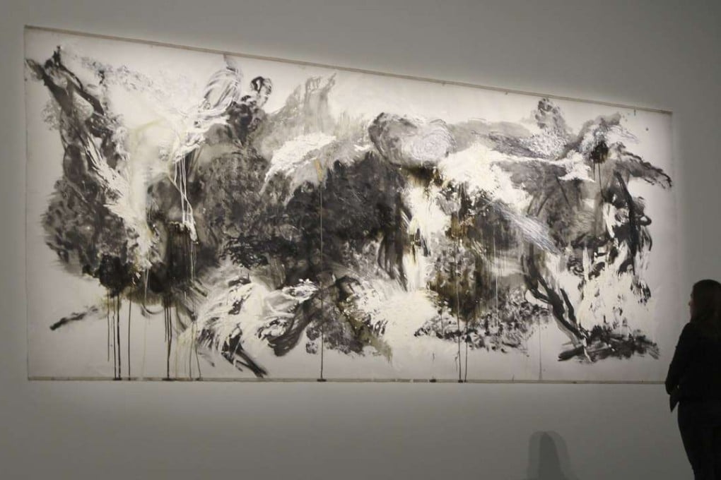 A visitor stands in front of Untitled No. 5, 2013-2014 by Shen Wei, part of the Asia Society exhibition Shen Wei: Dance Strokes. Photos: Bruce Yan