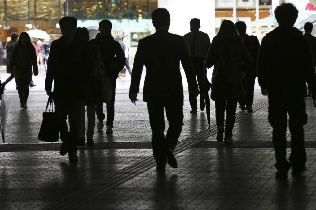 People walk on a street in Tokyo, each one a customer. Photo: AP,Koji Sasahara