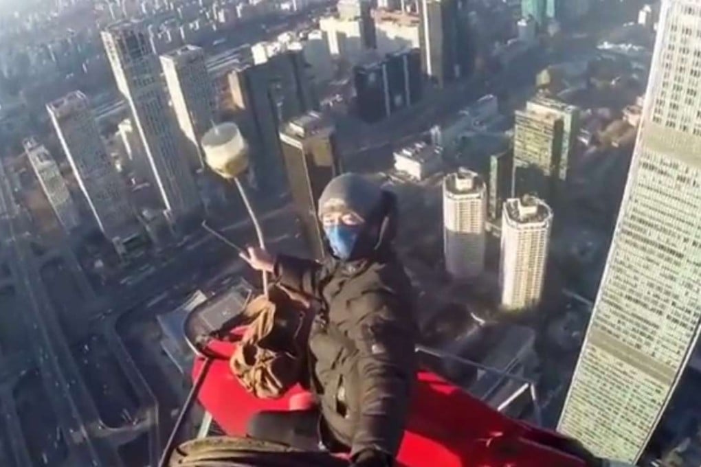 Joseph Lulu sits opposite the top of the World Trade Centre’s third tower. Photo: Joseph Lulu/YouTube