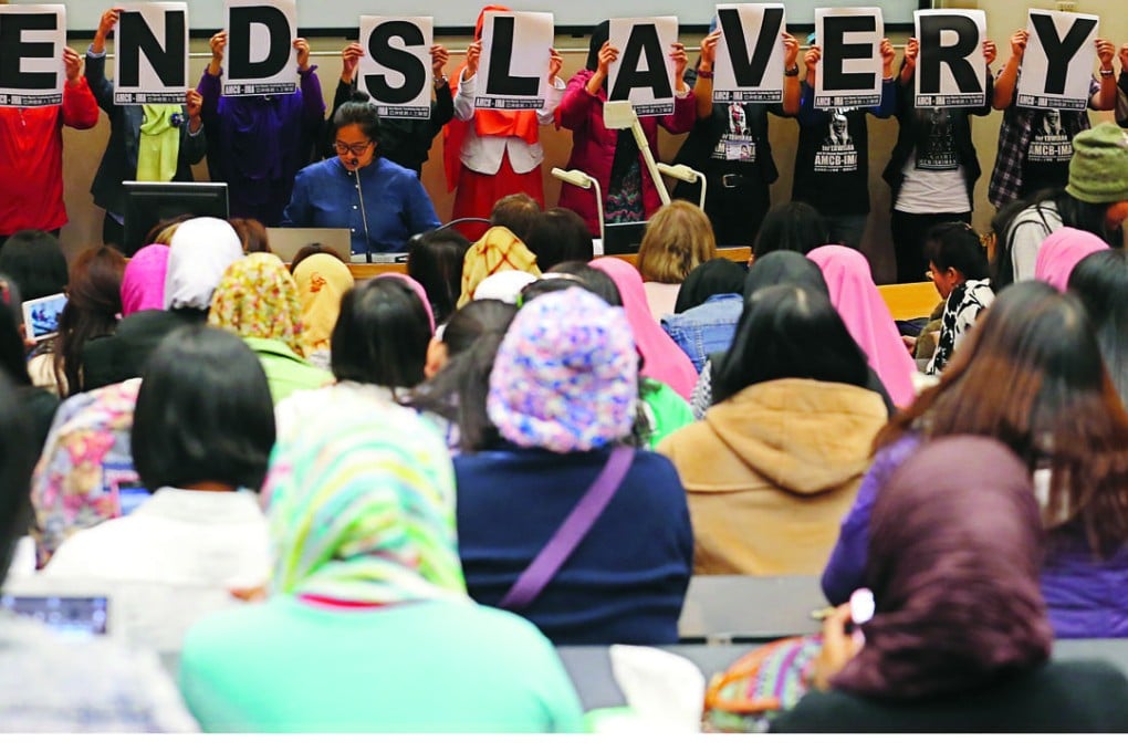 Members of the Asian Migrants' Coordinating Body make their views known during the screening of a film on Erwiana’s plight. Photo: Felix Wong