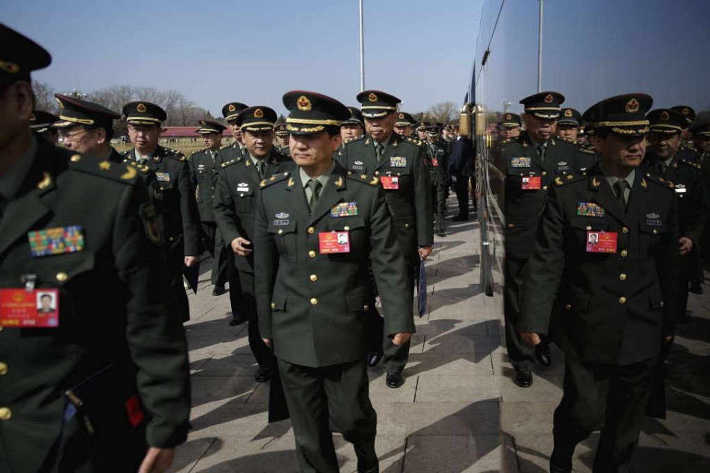 Delegates from China's People's Liberation Army (PLA) arrive at the Great Hall of the People to attend a plenary session of the National People's Congress in Beijing on March 9, 2016. Photo: AP