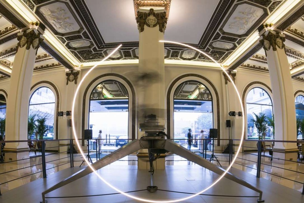 The industrial robot installed in The Peninsula lobby for The ADA Project - Love Art.