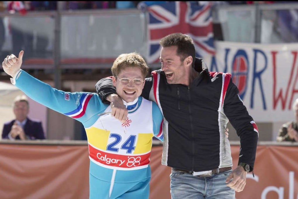 Eddie (Taron Egerton) and his coach Bronson Peary (Hugh Jackman) in a scene from Eddie the Eagle. Photo: Larry Horricks, 20th Century Fox