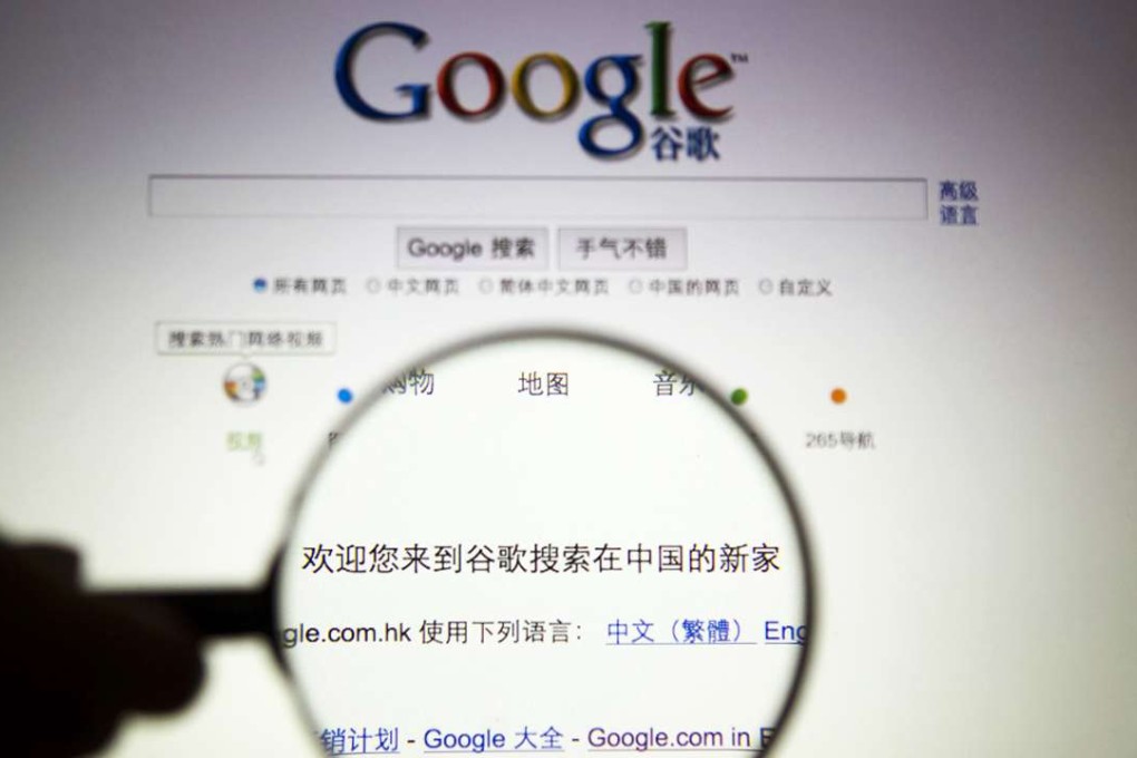 A person poses with a magnifying glass in front of a Google search page. Photo: Reuters