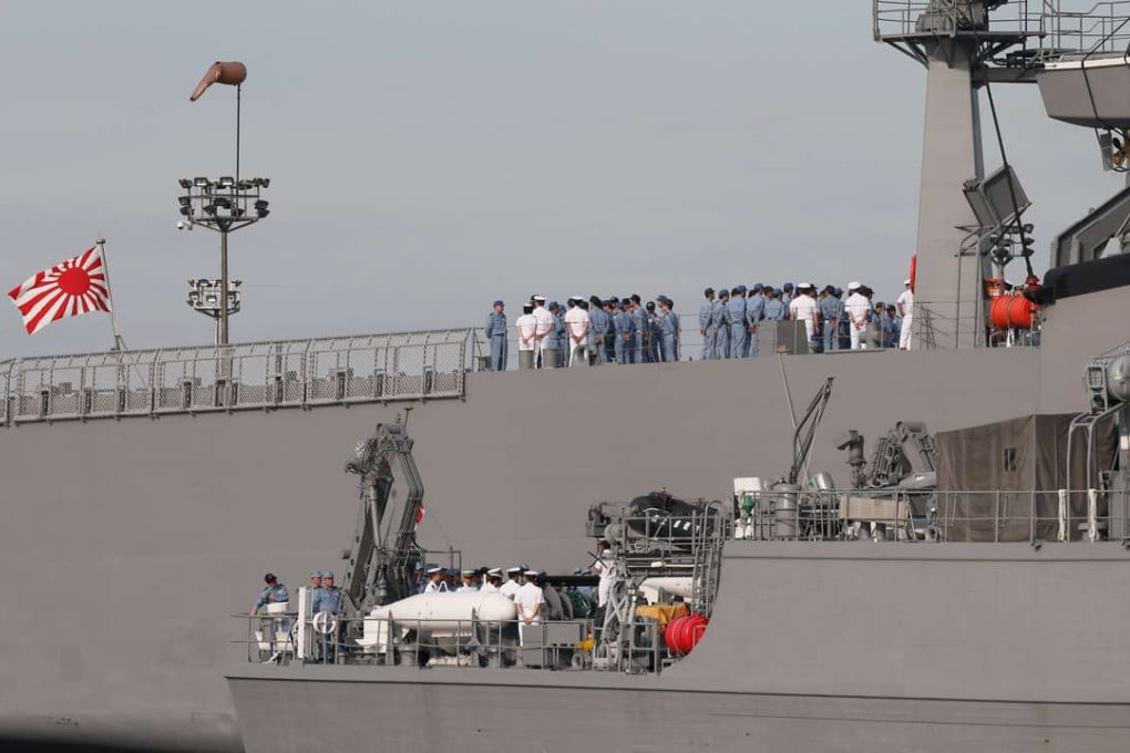 Navy officers assemble on board Japanese minesweeper class vessels. Photo: EPA