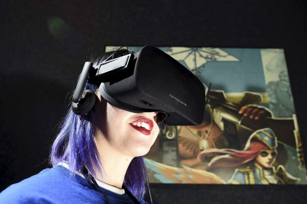Kaitlyn Innis, a brand ambassador for Oculus, demonstrates the Rift headset at an event in San Francisco. Photo: Reuters