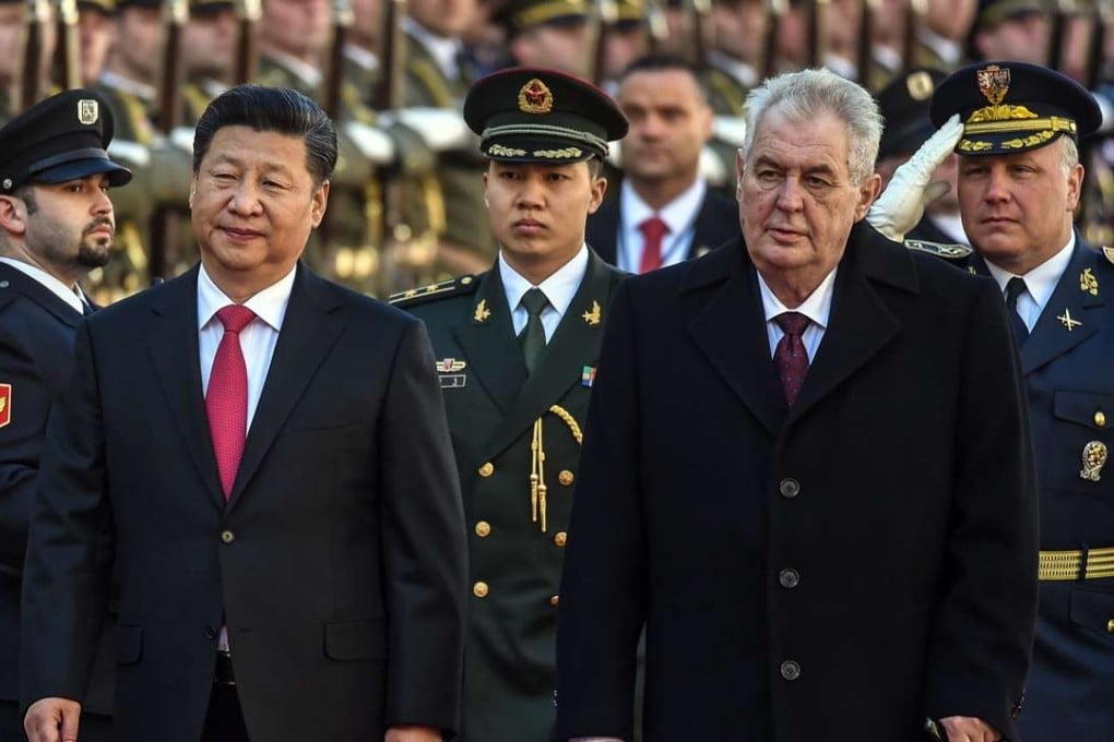 Chinese President Xi Jinping (left) and his Czech counterpart Milos Zeman inspect the guard of honour at Prague Castle in Prague, Czech Republic, on Tuesday. Photo: EPA