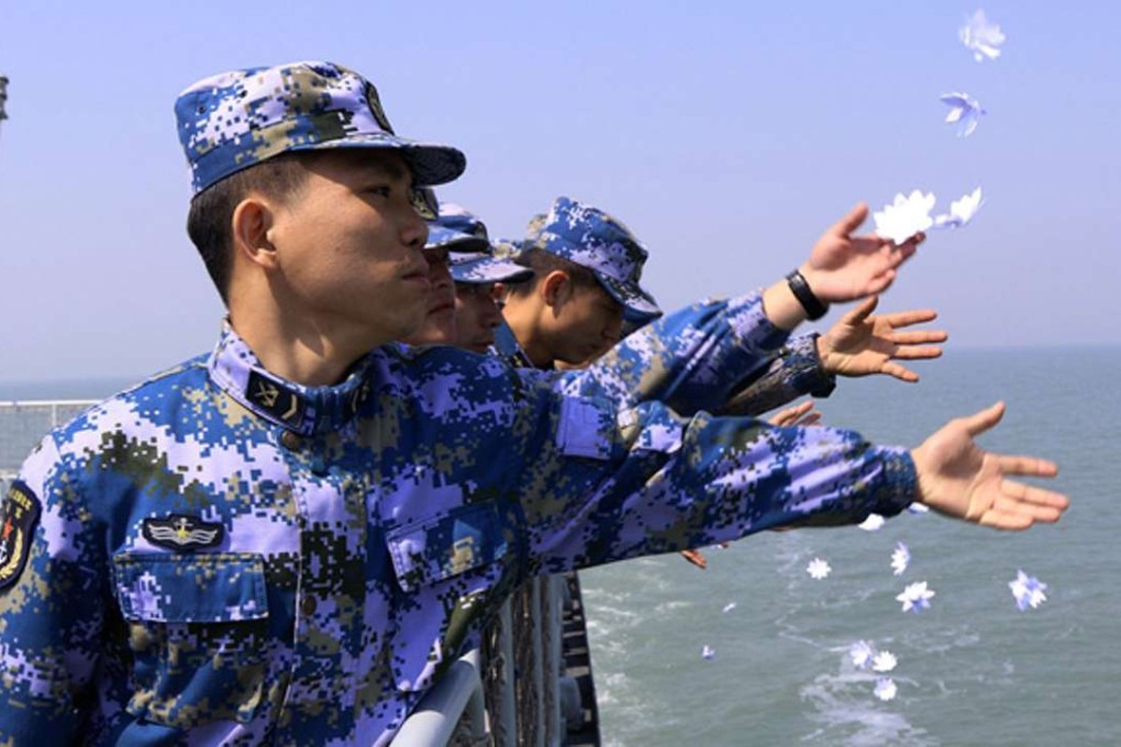 Chinese sailors throw flowers into the sea to mark a victory against Nationalist forces that secured the Yijiangshan Islands off the coast of eastern China in 1955. Photo: China’s Ministry of Defence