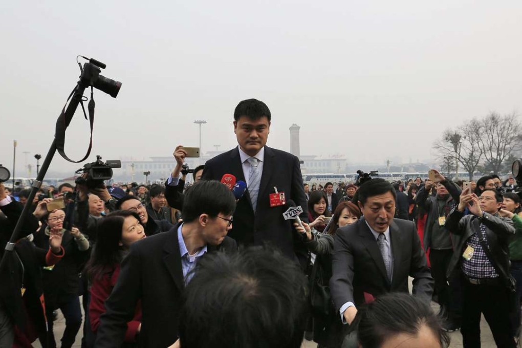 Former Chinese NBA star Yao Ming still stands above everyone else as he arrives for the opening of the fourth session of the Chinese People's Political Consultative Conference (CPPCC) at the Great Hall of the People in Beijing, on March 3. Photo: EPA