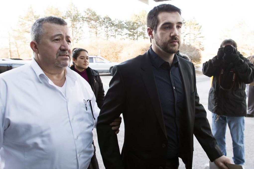 Marco Muzzo (right) arrives with family at the court house for his sentencing hearing in Newmarket, Ontario, on Tuesday. Photo: AP