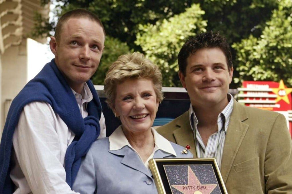 In this 2004 photo, Academy Award winner and television actress Patty Duke poses with her sons, actors Mackenzie Astin, left, and Sean Astin after being honoured with a star on the Hollywood Walk of Fame in Los Angeles. Photo: AP