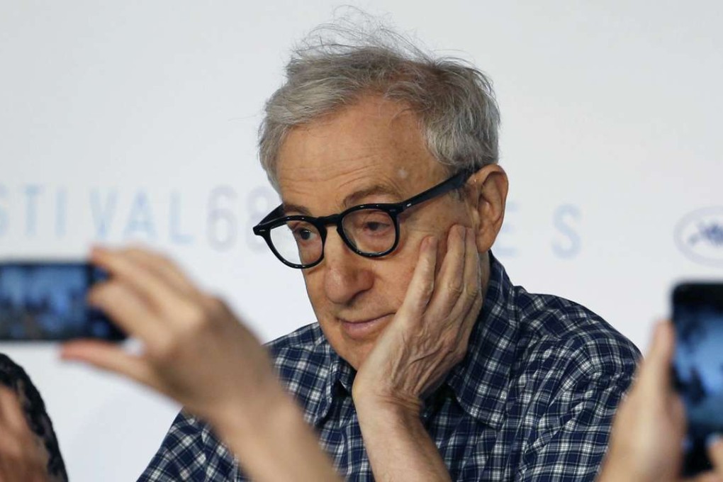 Journalists take pictures of film director Woody Allen at the 68th Cannes Film Festival. There is a growing realisation that the principal purpose of a mobile phone is to make telephone calls. Photo: Reuters