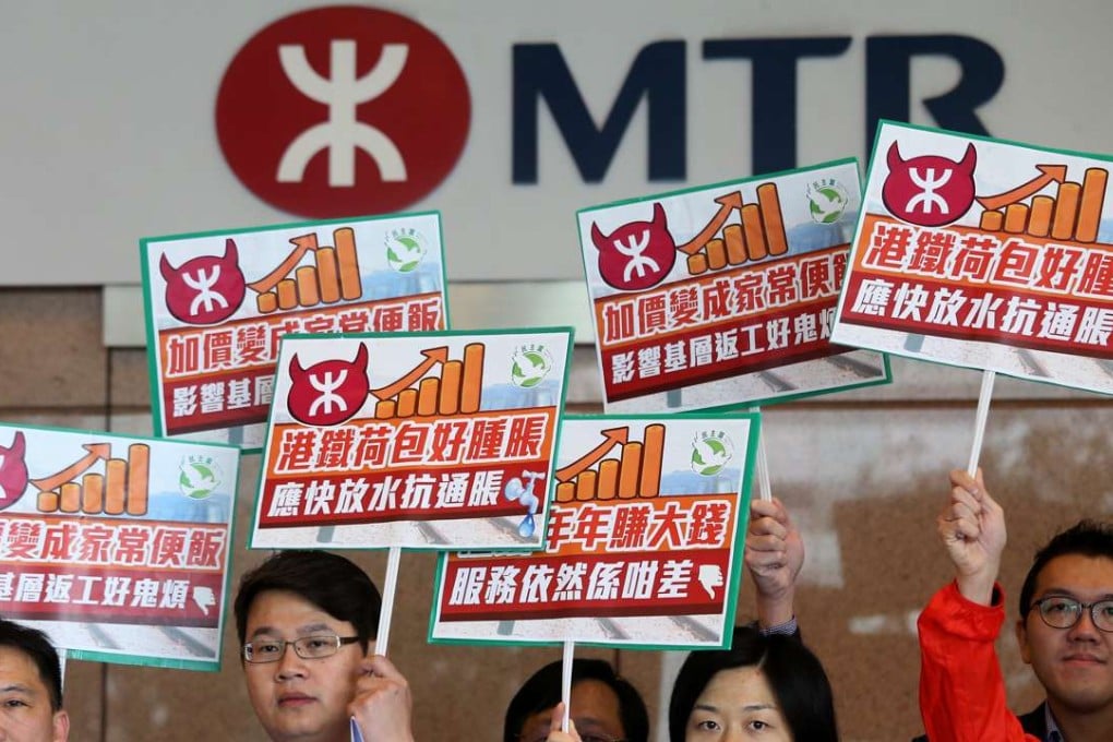 Democratic Party members demand an overhaul of the MTR fare adjustment mechanism at MTR headquarters in Kowloon Bay. Photo: Dickson Lee.