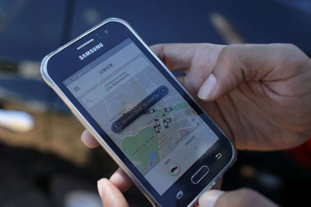 Hong Kong taxi drivers are facing competition from ride-hailing apps such as Uber . Photo: AP