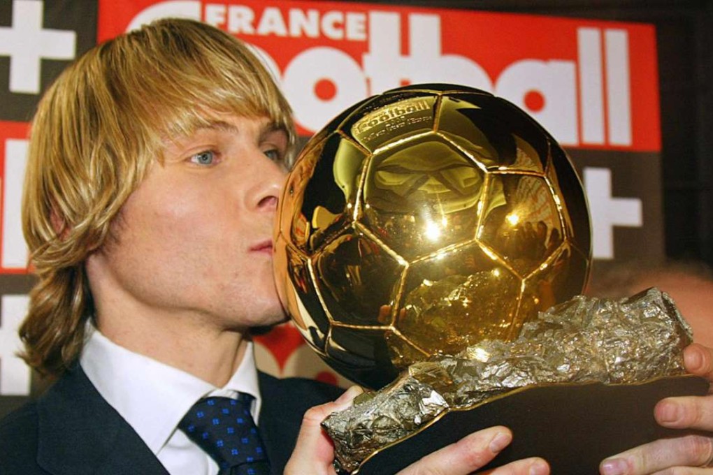 Pavel Nedved kisses the Ballon d'Or he won in 2003. Photo: AFP