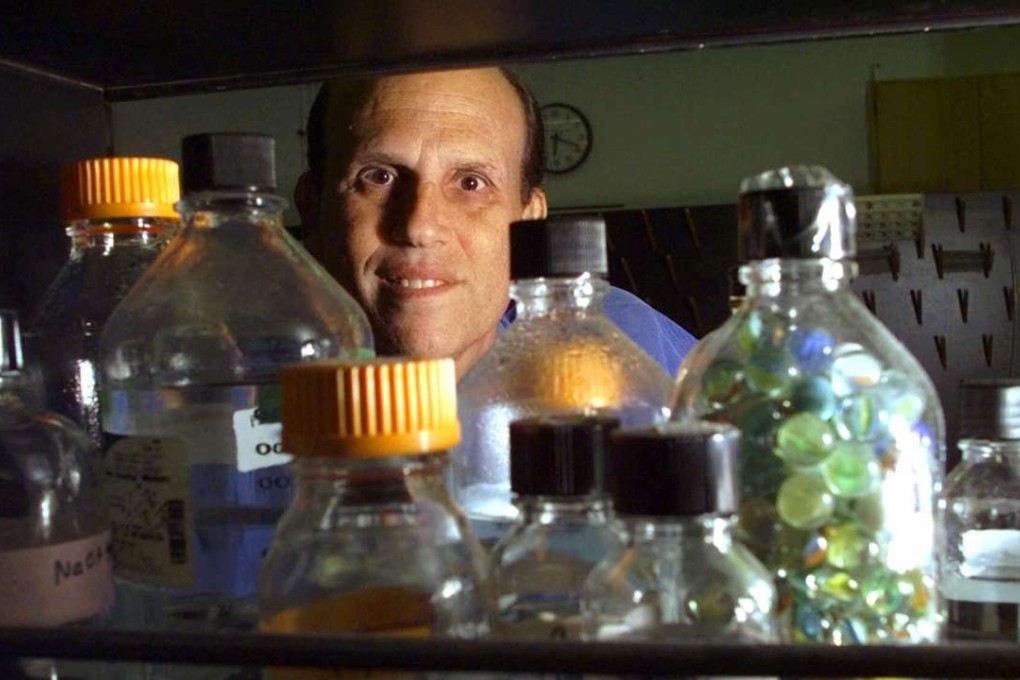 Wall Street's former junk bond king Michael Milken in a UCLA nutrition laboratory in Los Angeles. After being diagnosed with prostate cancer, Milken turned to herbs, meditation and even exotic aroma therapies in his search for a cure. Photo: AP