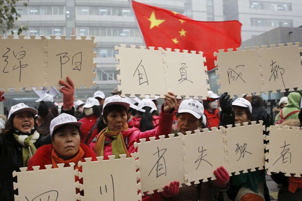 Parents who have lost their only child gather in front of the National Health and Family Planning Commission office in Beijing, in December 2015. They were demanding financial and legal support from the government for their loss. Photo: Reuters