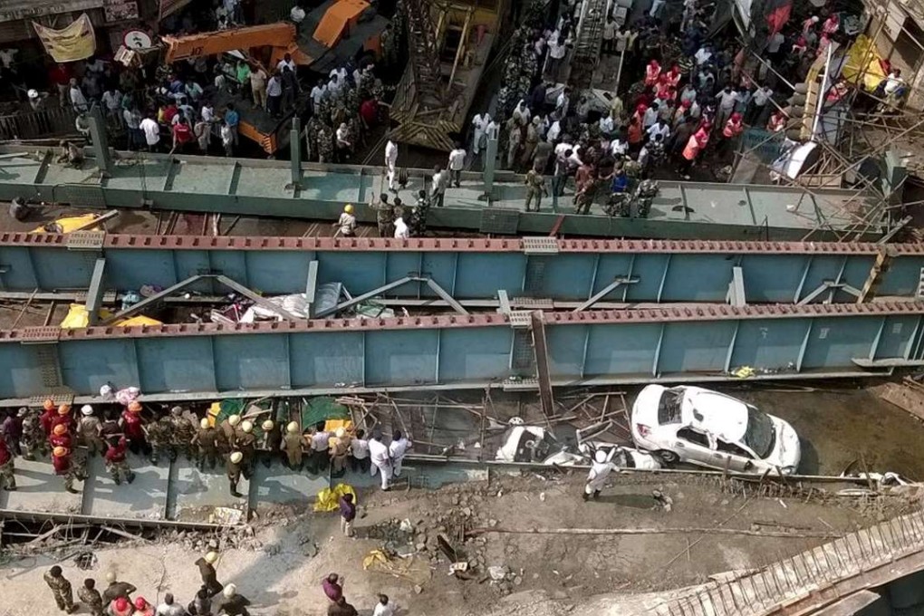 Police and passers-by were using their hands to try to move giant slabs of concrete and metal to reach those trapped. Photo: Reuters