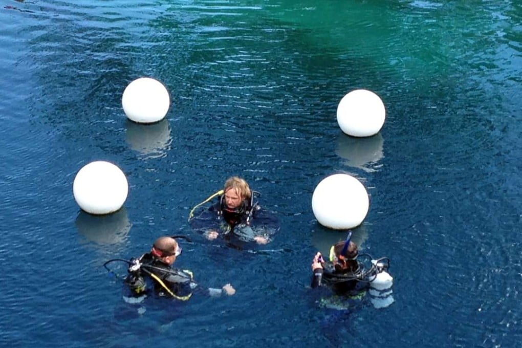 This June 6, 2015 file photo shows divers at Blue Hole in Santa Rosa, New Mexico, where 43-year-old Shane Thompson drowned on Saturday. Photo: AP