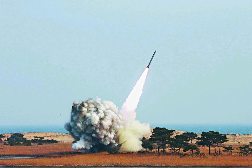 An undated photograph made available on March 4, 2016, by the North Korean news agency KCNA shows the test-firing of a new-type of large-calibre multiple launch rocket system by the North Korean military. Photo: EPA