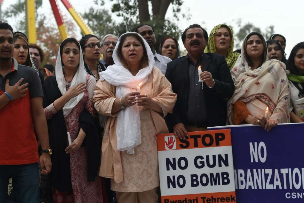 Pakistani civil society members gather at the site of the suicide blast in Lahore on March 28, 2016. Photo: AFP