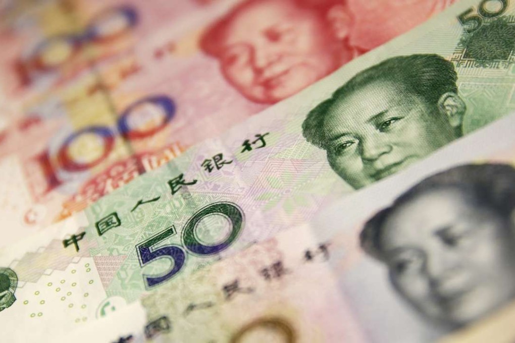 Chinese yuan or renminbi (RMB) notes. The currency weakened on Friday morning. Photo: EPA, HOW HWEE YOUNG