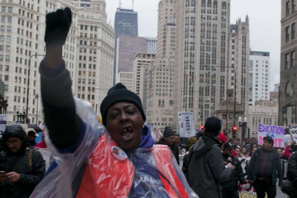 A woman shouts slogans during a rush-hour rally for a demonstration against budget cuts in Chicago. Photo: Xinhua