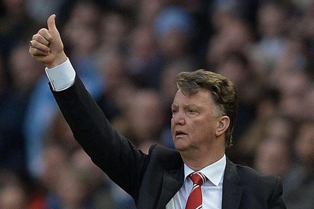 And back at you: Manchester United manager Louis van Gaal has Alex Ferguson on his side. Photo: AFP