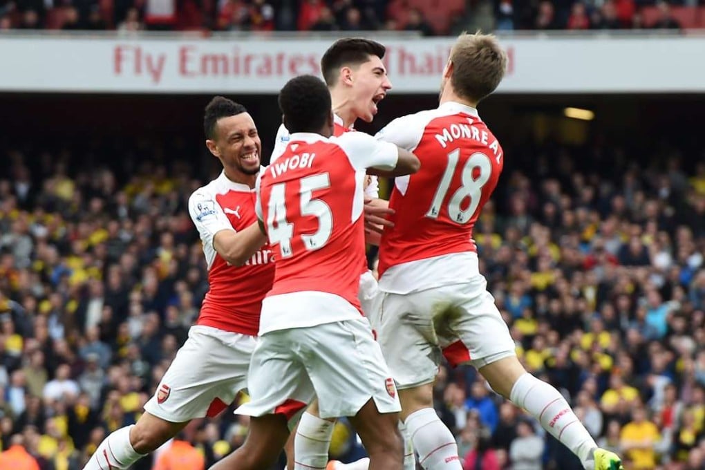 Arsenal’s Hector Bellerin (centre) celebrates with teammates after scoring for Arsenal against Watford. Photo: EPA