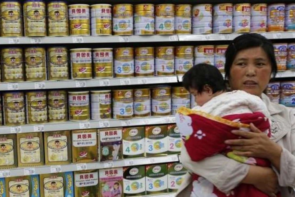 A file picture of a woman and baby shopping for milk powder in Beijing. Photo: Reuters
